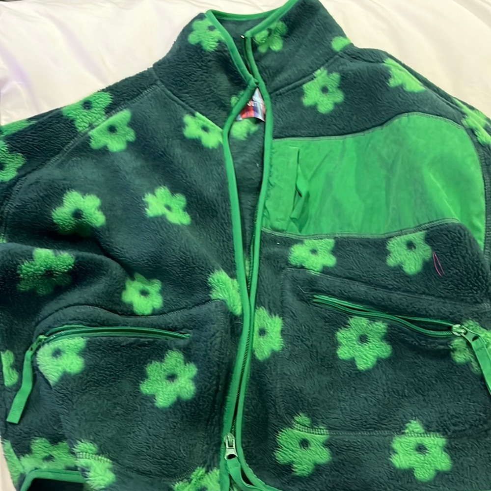 Green, warm jacket with flowers on them. Many pockets super cute.
